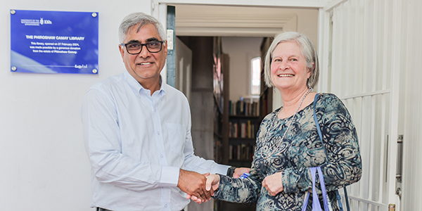 Professor Imraan Valodia and Anne Gordon celebrate the opening of the Phiroshaw Camay Library Professor Imraan Valodia and Anne Gordon celebrate the opening of the Phiroshaw Camay Library